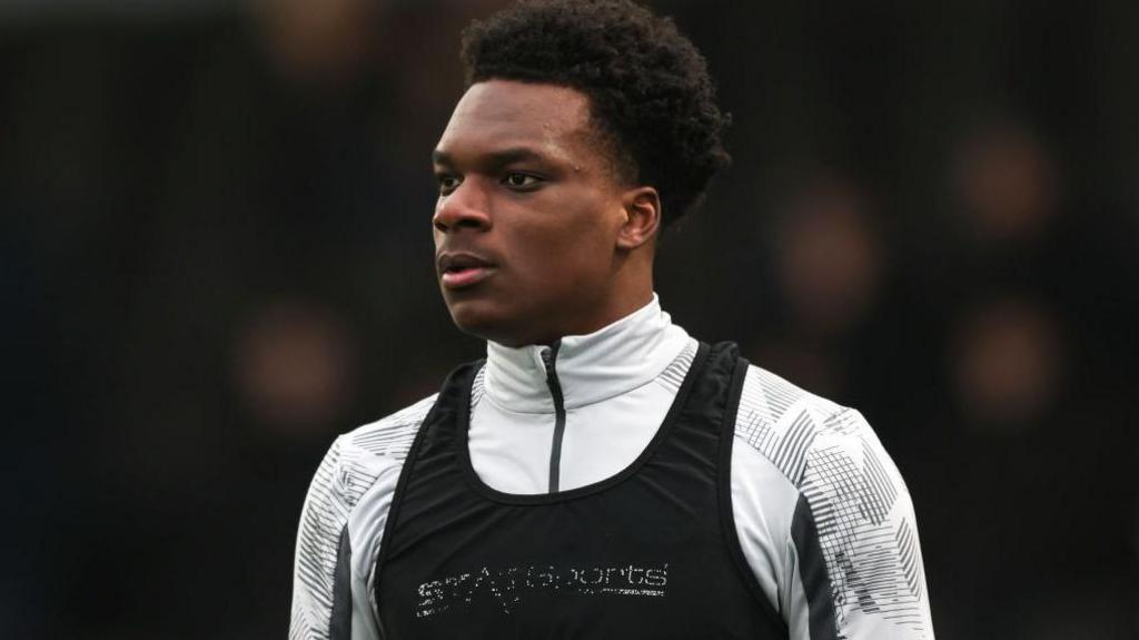 Deji Elerewe warms up before a League Two match between Bromley and Colchester United