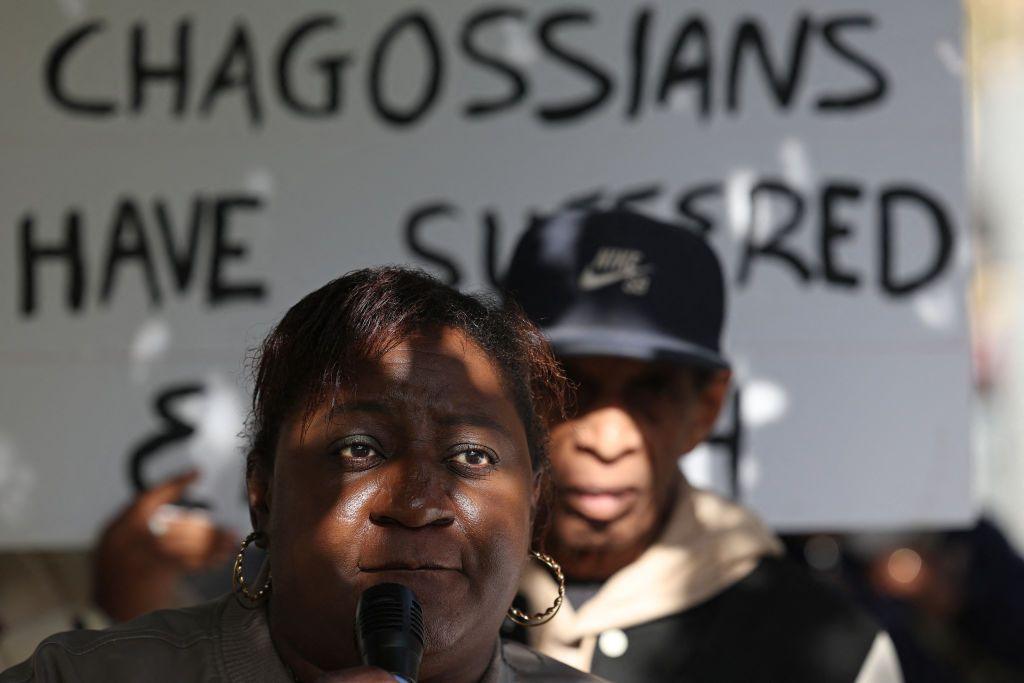 Members of the Chagossian community gather with banners and placards outside the parliament in London, the UK.