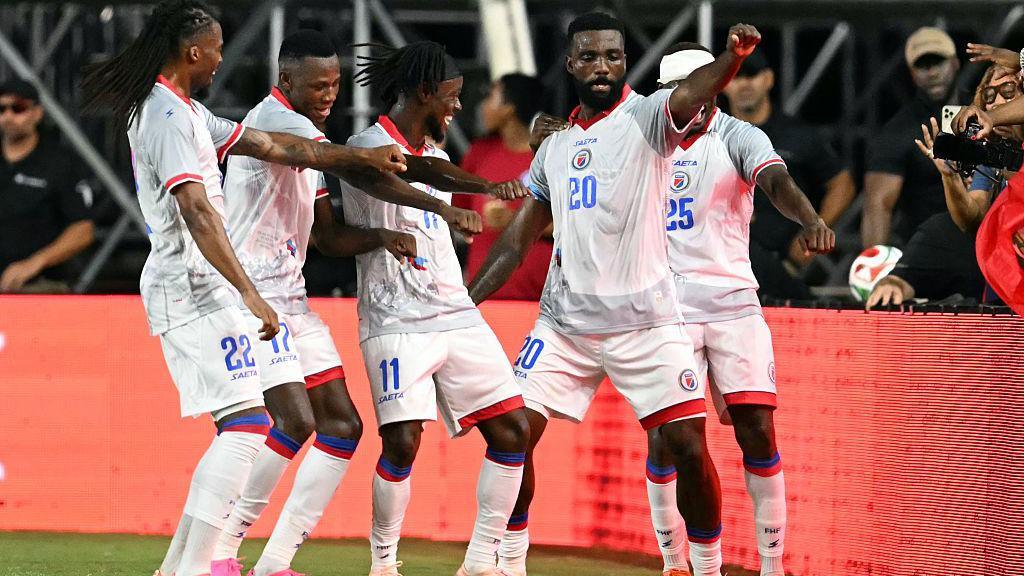 Haiti's forward #20 Frantzdy Pierrot celebrates with teammates after scoring his team's third goal during an international friendly football match between Haiti and New Zealand at Inter Miami CF Stadium in Fort Lauderdale, Florida on June 2, 2026.