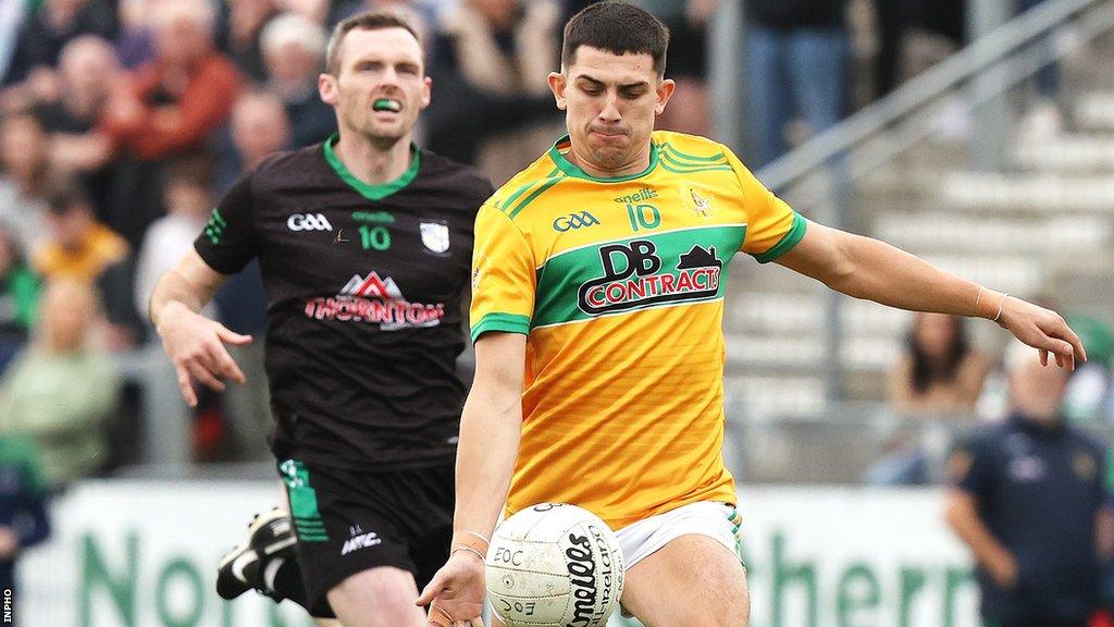 Dunloy's Seaan Eliott bursts away from Cargin's James Laverty before attempting a shot