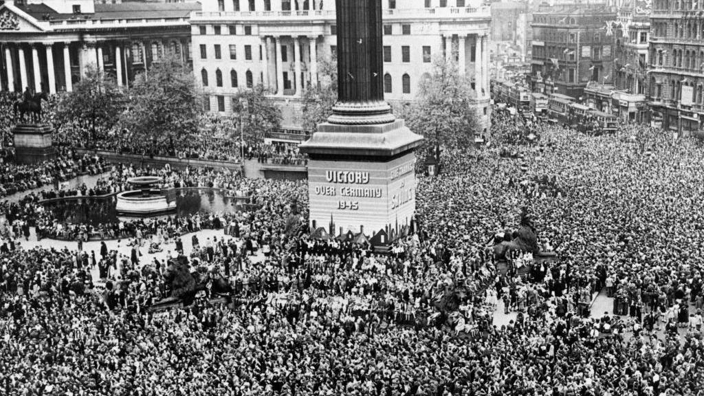 Thousands of people standing in Trafalgar Square on 8 May 1945.
