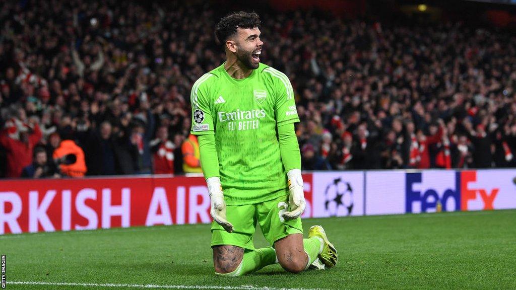 Arsenal goalkeeper David Raya celebrates his penalty heroics against Porto