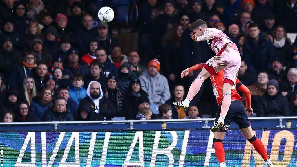 Grimsby's Gavan Holohan scores at Luton