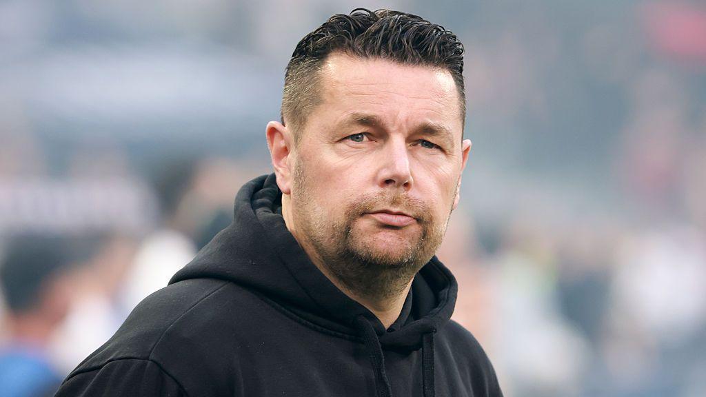 Pierre Sage pictured on the touchline with Lens