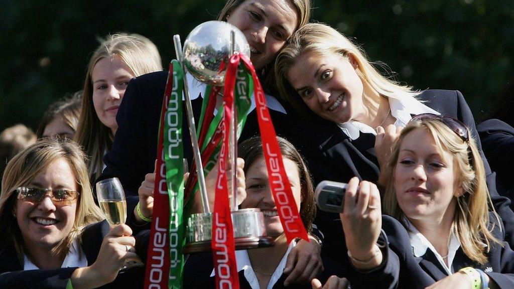 England's women's Ashes winners hold the trophy and take selfies on a bus tour