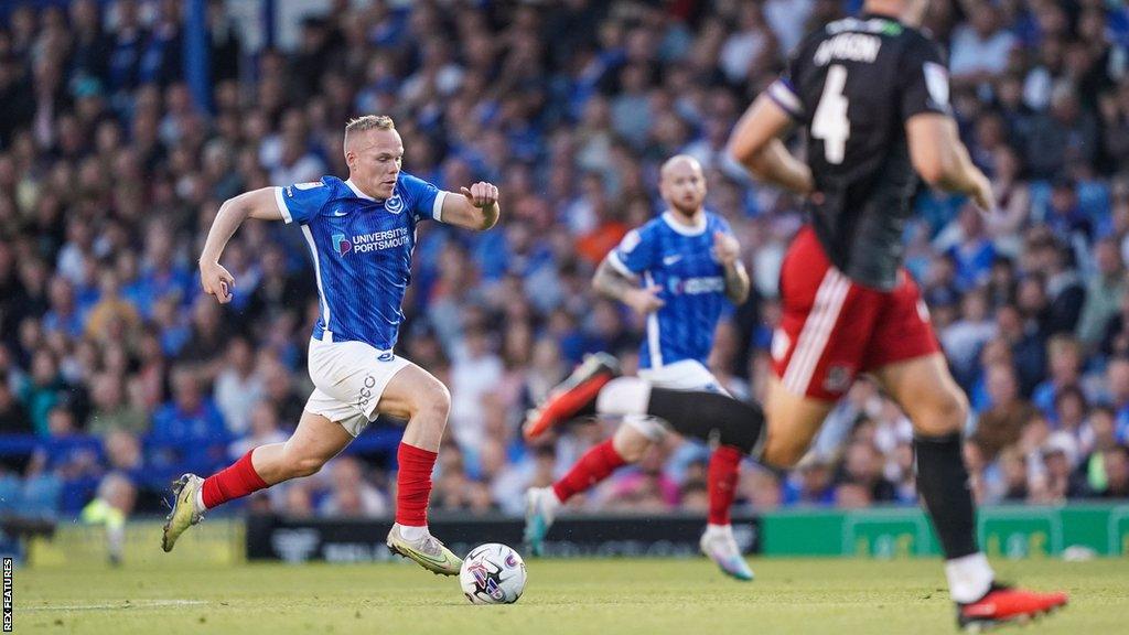 Pompey winger Anthony Scully dribbling the ball toward the opponents net during a League One game early in the 2023-24 season.