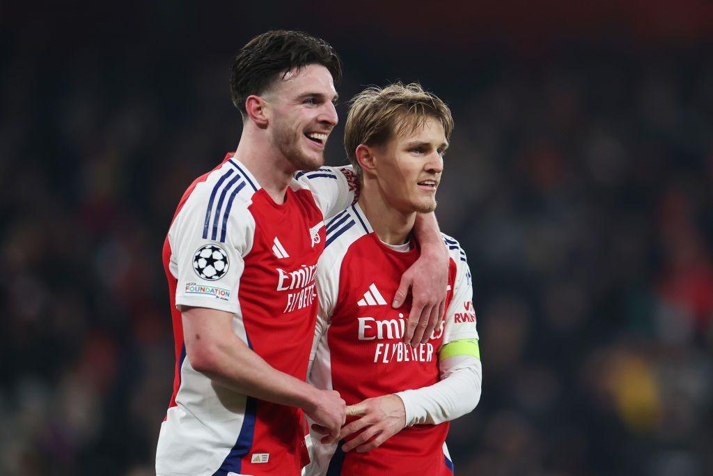 Martin Odegaard of Arsenal celebrates scoring his team's third goal with teammate Declan Rice