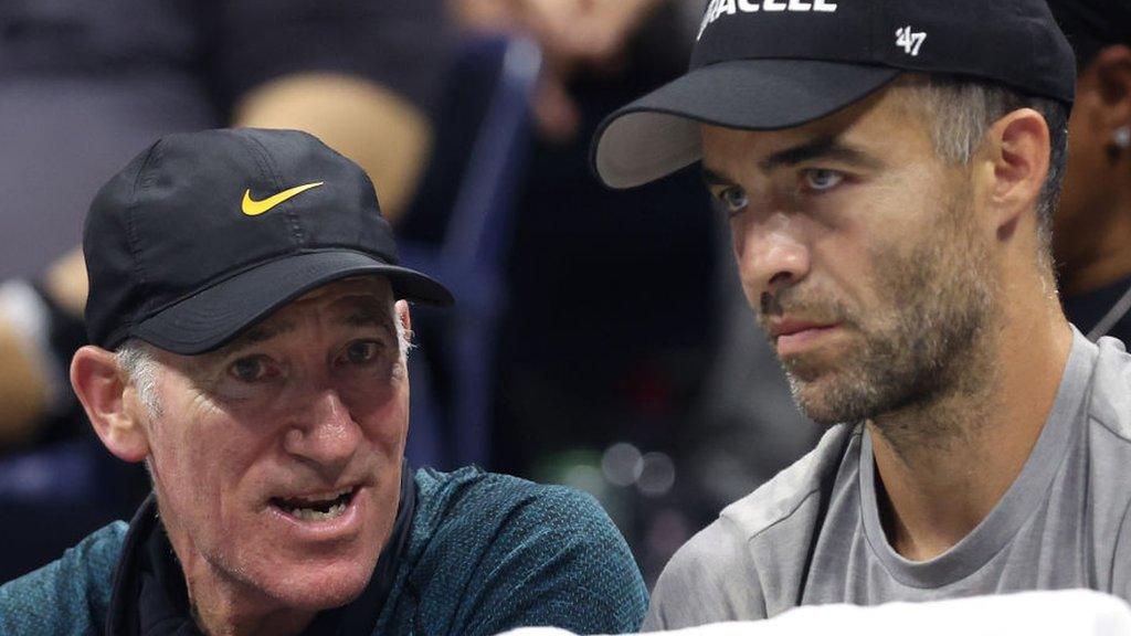 Brad Gilbert and Pere Riba talk during Coco Gauff's match at the US Open