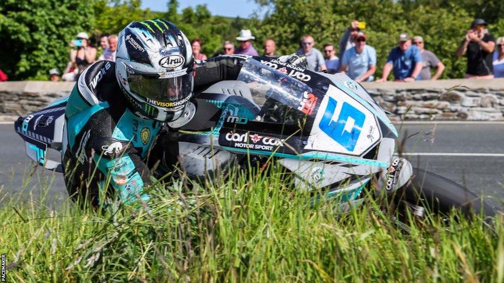 Michael Dunlop shaves the grass on his Yamaha Supersport machine