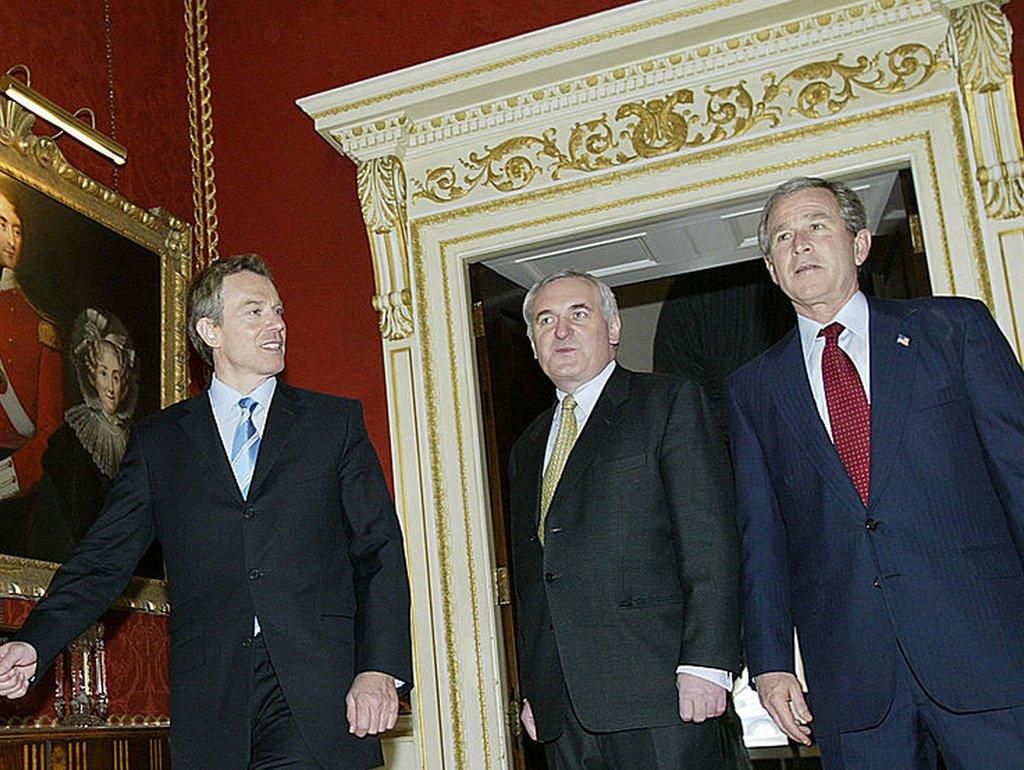 US President George W. Bush (R), British Prime Minister Tony Blair (L), and Prime Minister of Ireland Bertie Ahern walk into a lunch meeting 08 April 2003 at Hillsborough Castle in Hillsborough.