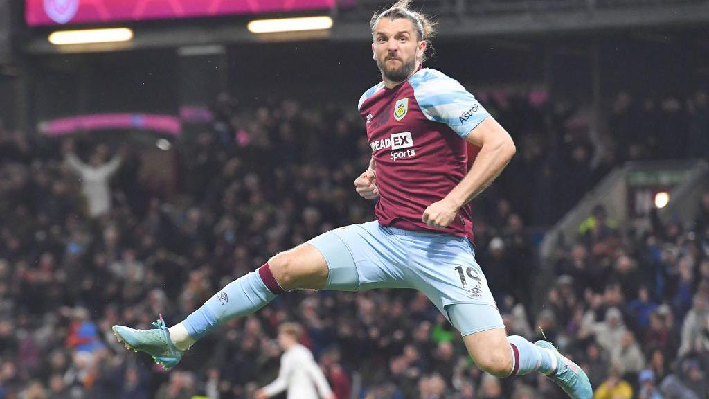 Jay Rodriguez jumps in the air to celebrate a goal for Burnley