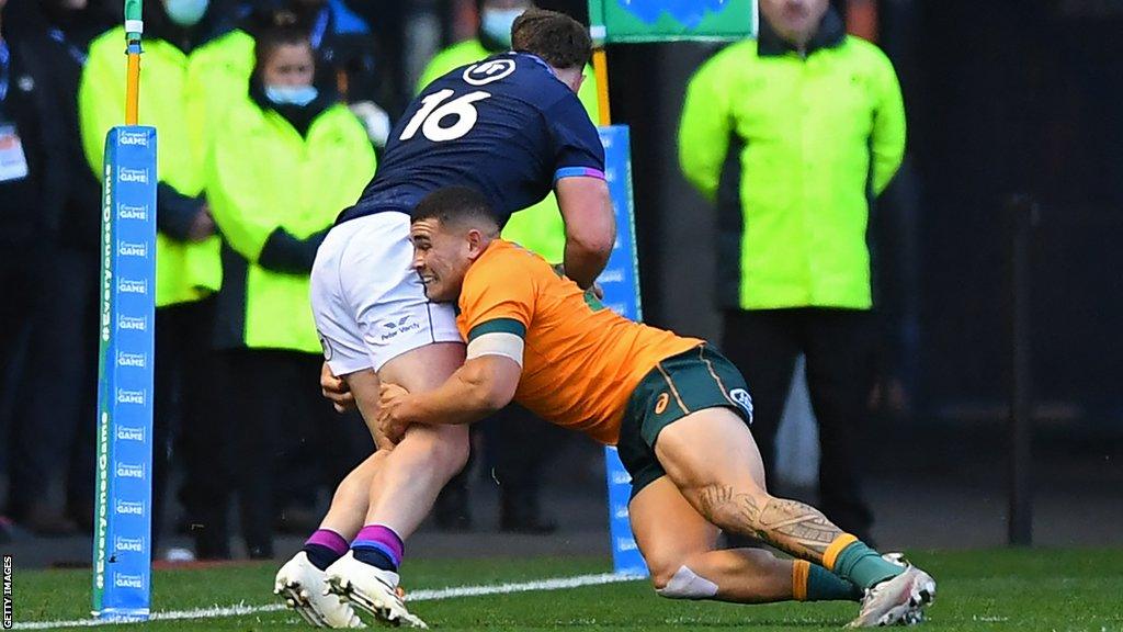 Ewan Ashman squeezes in at the corner to score against Australia for Scotland