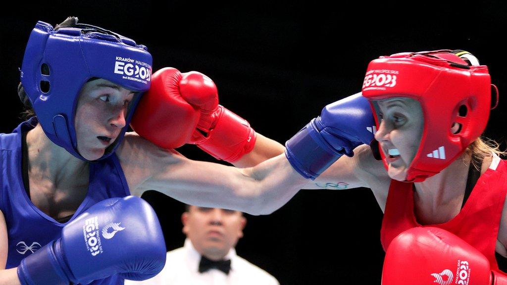 Melissa Mortensen and Michaela Walsh exchange punches in the quarter-final contest in Poland