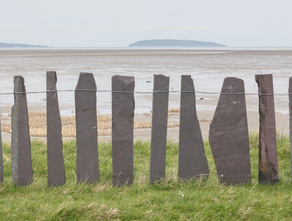 Slate fence and Puffin Island, Lavan Sands, Gwynedd.