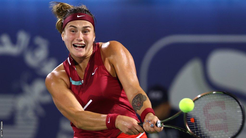 Belarus' Aryna Sabalenka returns the ball against Ukraine's Marta Kostyuk in Dubai