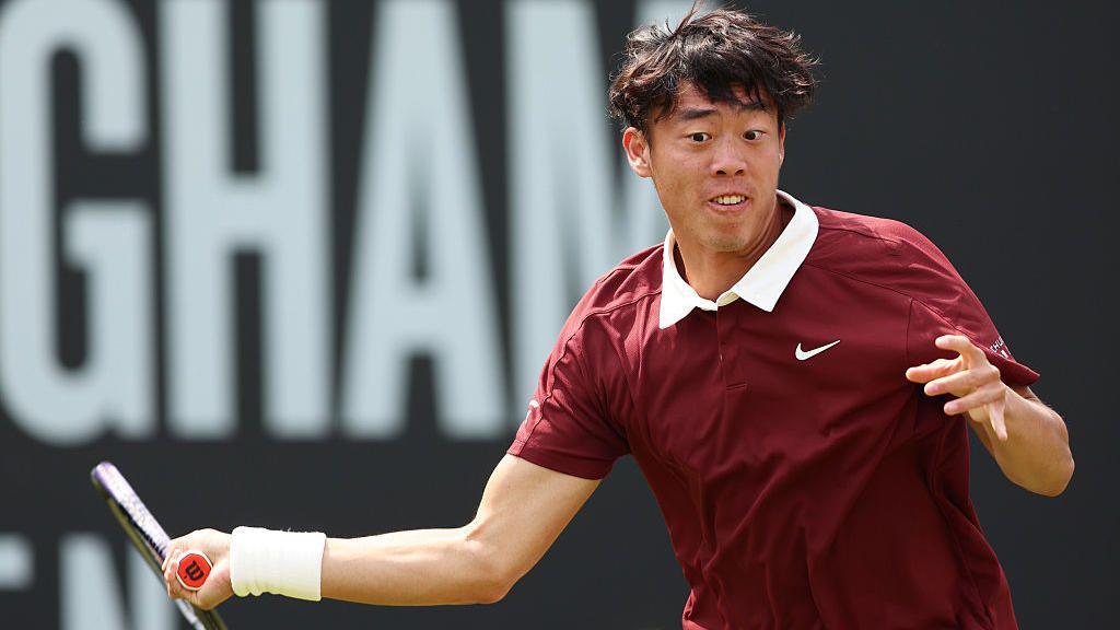 Coleman Wong hits a forehand at the US Open
