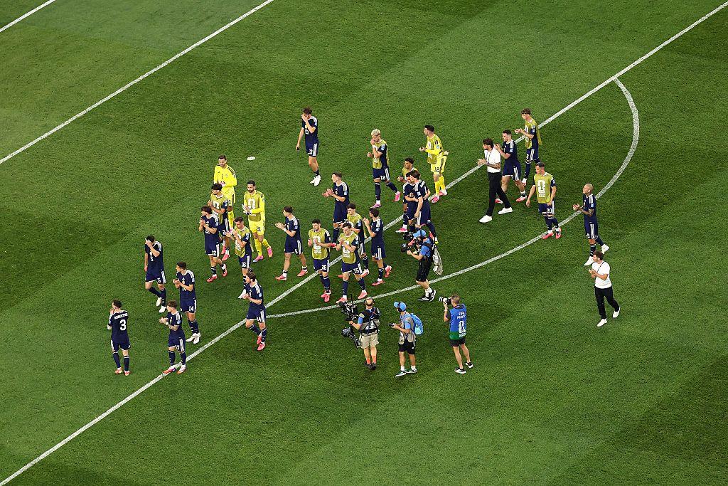 The Scotland players applaud the Tartan Army at full-time as attention now turns to Brazil on Wednesday evening