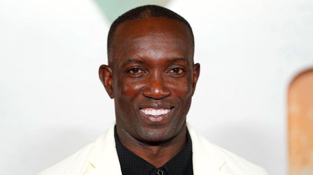 Dwight Yorke smiles