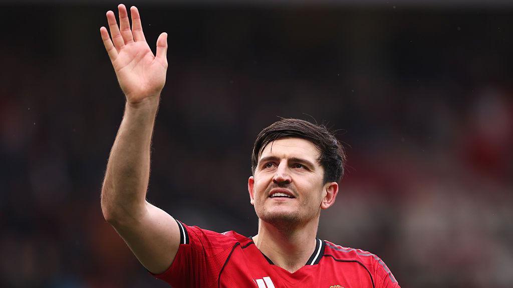 Harry Maguire of Manchester United waves at the fans
