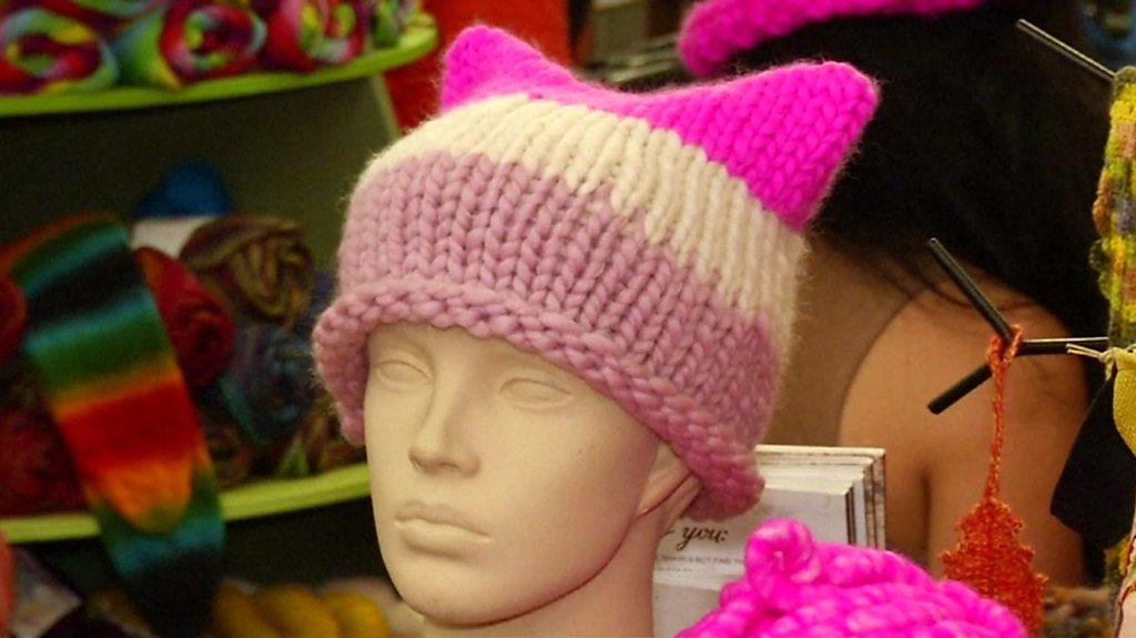 Mannequin wears knitted pink hat with cat ears