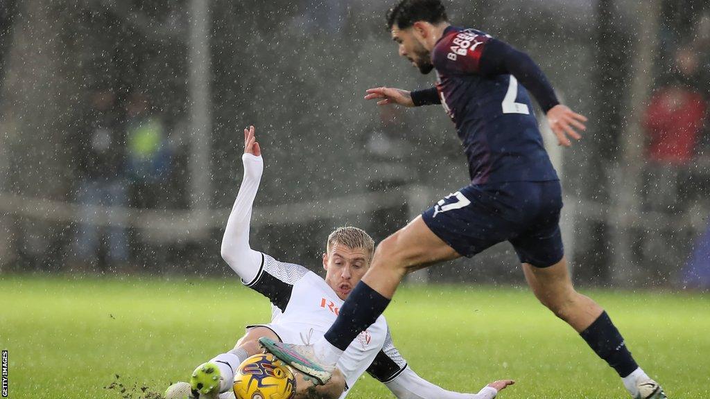 Swansea's Jay Fulton makes a sliding challenge on West Brom's Alex Mowatt