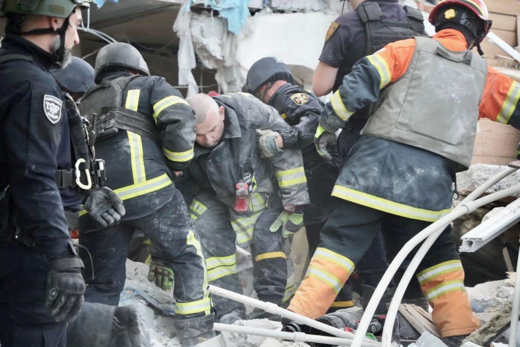 Rescuers search rubble for survivors after Russian shelling of residential area