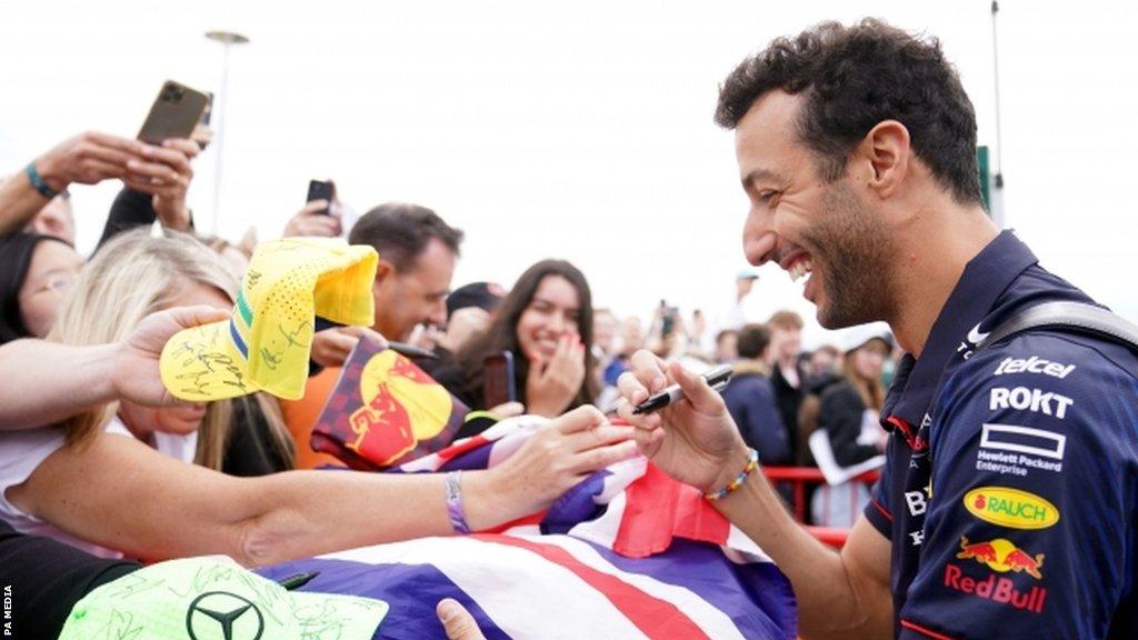 Daniel Ricciardo signs autographs for fans at the British Grand Prix in 2023