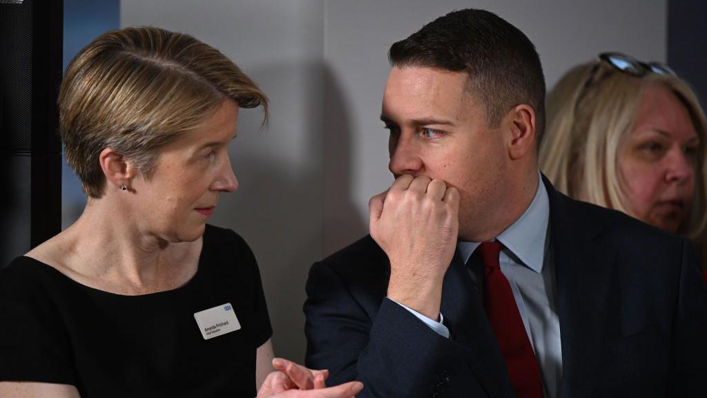 Pritchard and Wes Streeting speaking as they listen to a speech by Prime Minister Keir Starmer on reducing NHS wait times