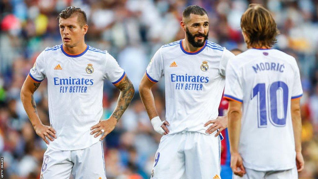 Toni Kroos, Karim Benzema and Luka Modric playing for Real Madrid