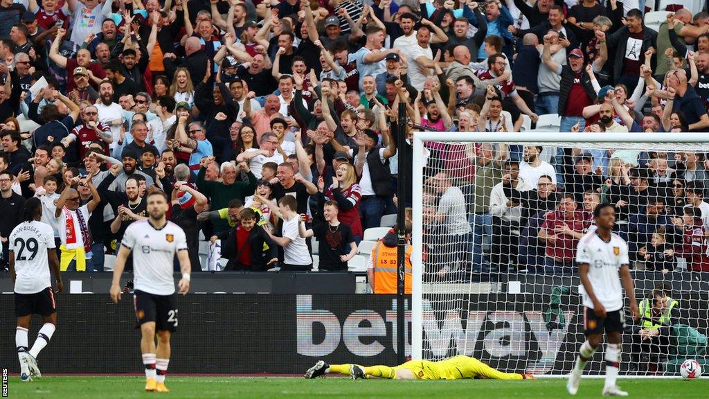 David De Gea lying on the pitch face down after letting Said Benrahma's shot squirm past him