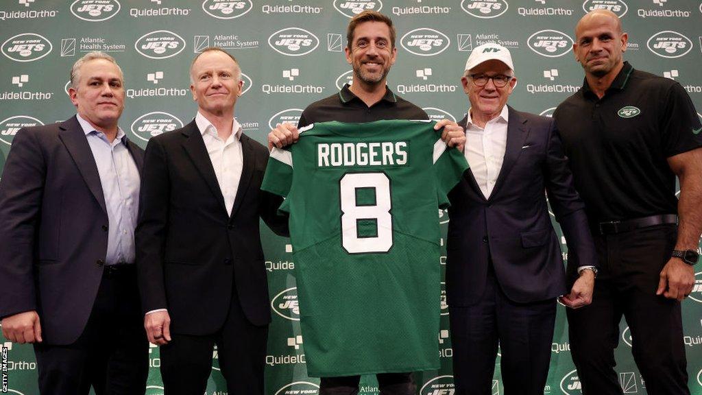 New York Jets team president Hymie Elhai, team owner Christopher Johnson, quarterback Aaron Rodgers, team owner Woody Johnson, and head coach Robert Saleh pose during an introductory press conference