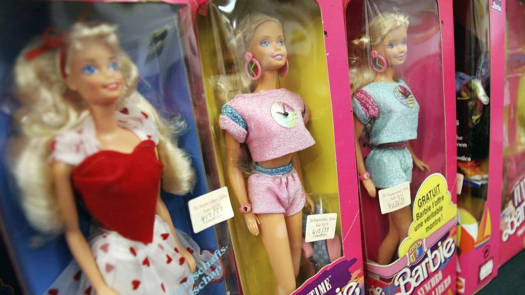 Barbie dolls in boxes.