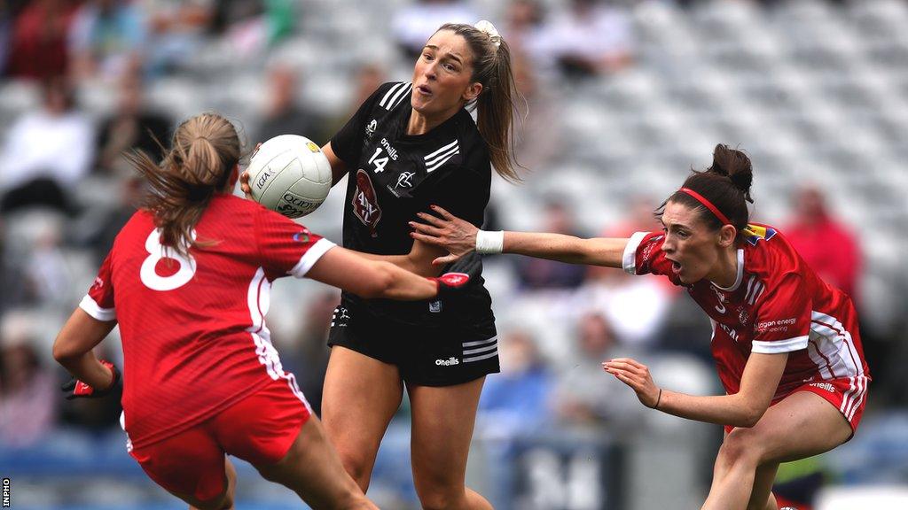 Tyrone pair Joanne Barrett and Aoibhinn McHugh tackle Kildare's Roisin Byrne in the Croke Park final