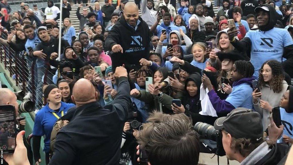 Dwayne Johnson meeting fans at the opening game of the 2023 XFL season