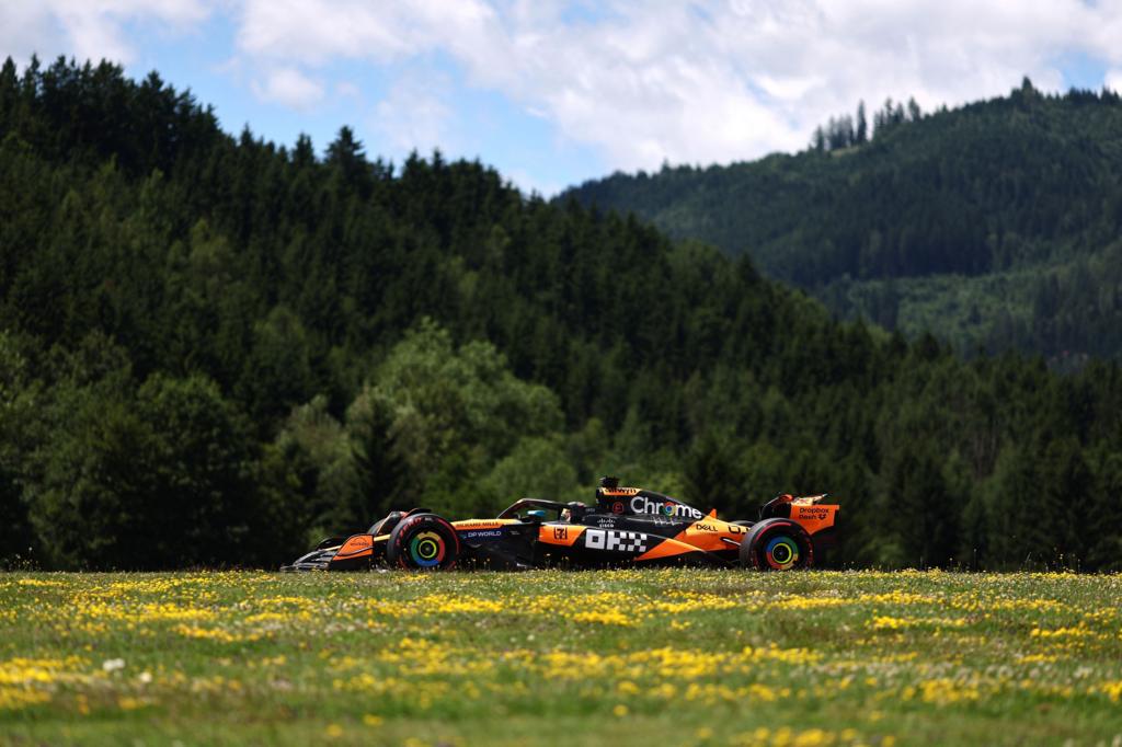 McLaren's Oscar Piastri during Austrian Grand Prix practice with a forest of trees in the background