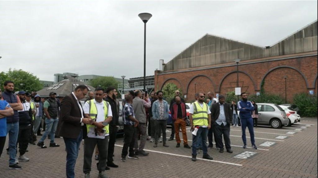 Drivers gathering to protest in a car park