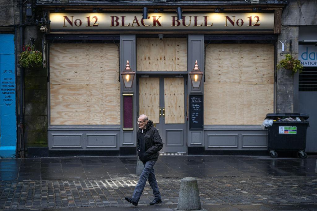 Boarded up pub in lockdown