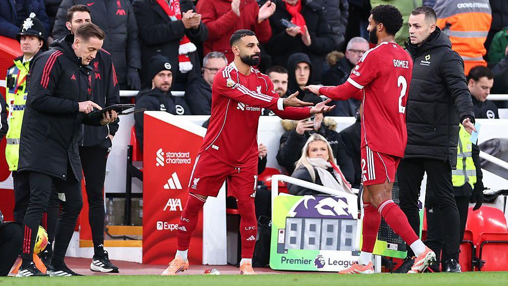 Mohamed Salah of Liverpool comes on for Joe Gomez of Liverpool during the Premier League match between Liverpool and Brighton & Hove Albion at Anfield on December 13, 2025 in Liverpool