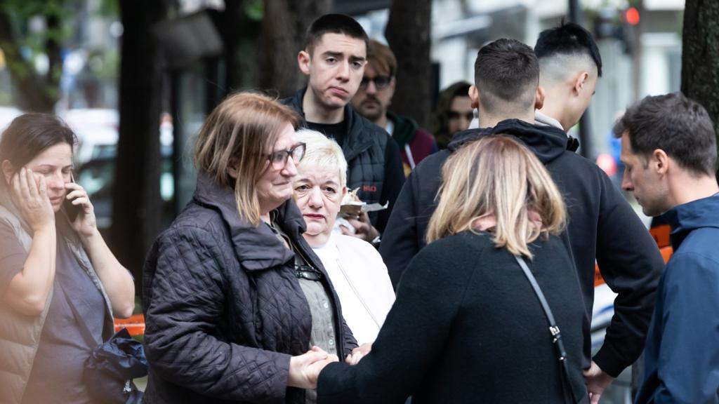 Women react near the 'Vladislav Ribnikar' elementary school on May 3, 2023 in Belgrade, Serbia