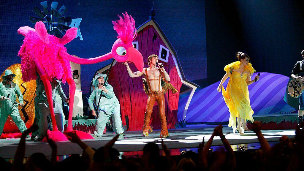 Scissor Sisters on stage with giant, day-glo puppets during a performance at the 2005 Brit Awards