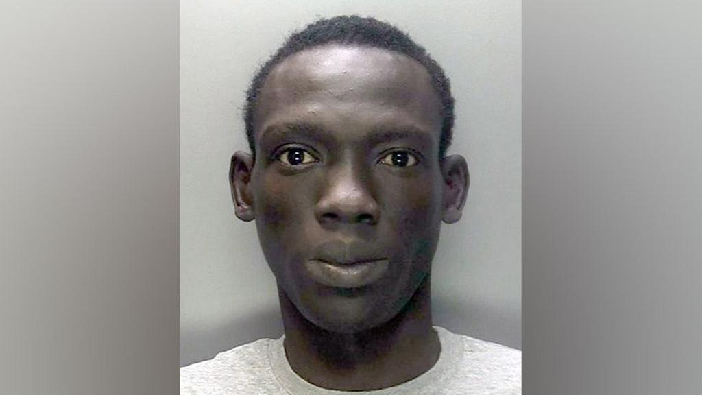 Police mugshot of Deng Majek
