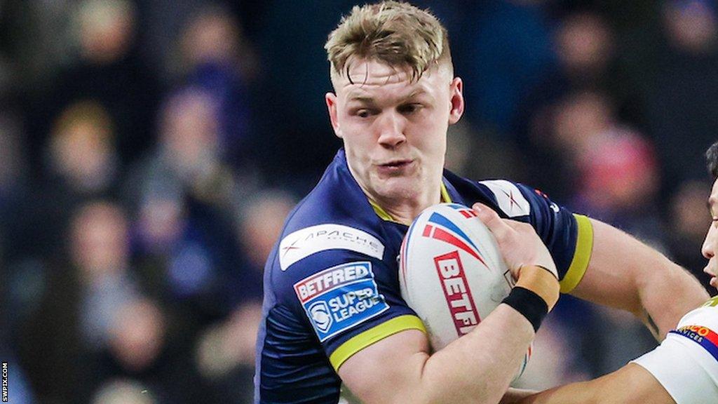 James McDonnell runs at the Wakefield defence with Mason Lino making a tackle