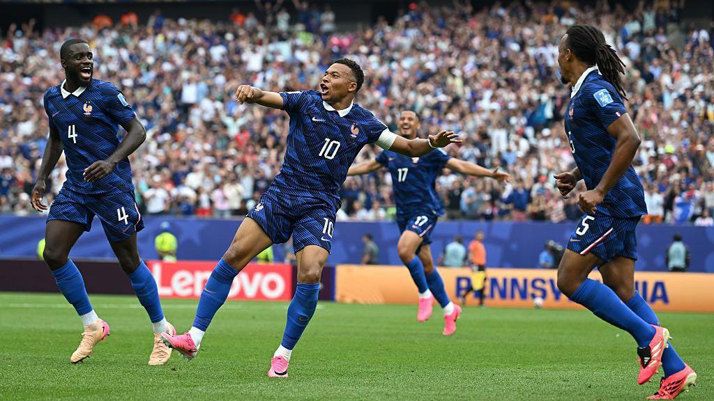 Kylian Mbappe celebrating scoring France's first goal.