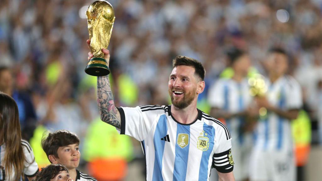 Lionel Messi of Argentina lifts the FIFA World Cup trophy 