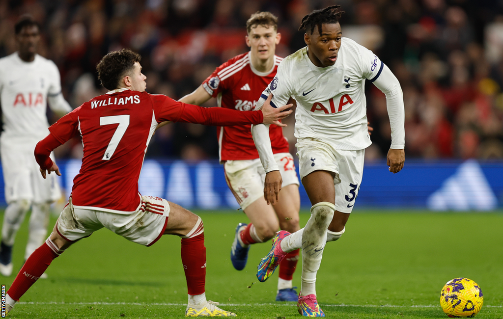 Tottenham's Destiny Udogie in action against Neco Williams of Nottingham Forest