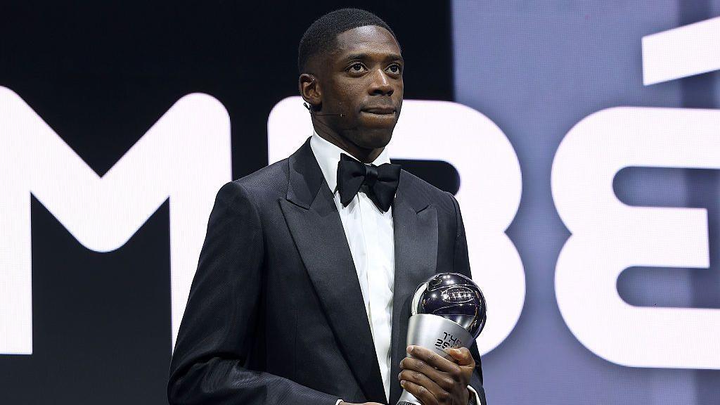 Ousmane Dembele on stage with the men's player of the year trophy at the Fifa Best Awards 2025 in Doha