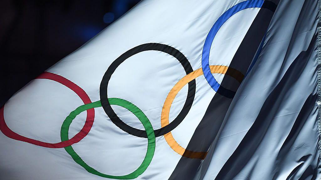 The Olympic flag flies in the wind during the closing ceremony of the 2016 Rio Olympic Games