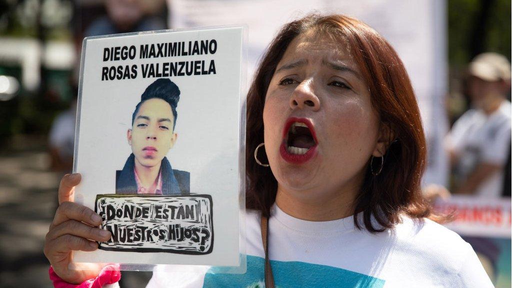 Mothers and relatives of disappeared people of Mexico and Central America carry images of their missing relatives, during a protest demanding justice and help, along Reforma avenue, in Mexico City, Mexico on May 10, 2022.