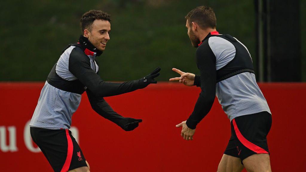 Diogo Jota and James Milner of Liverpool during a training session