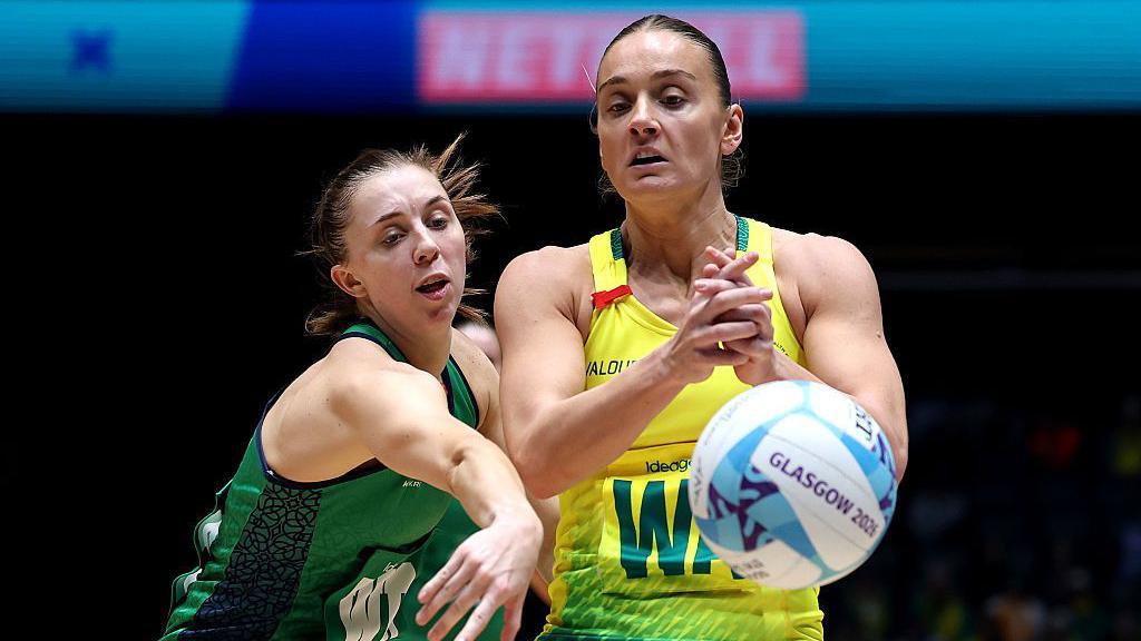 Niamh Cooper of Team Northern Ireland and Liz Watson of Team Australia battle for possession